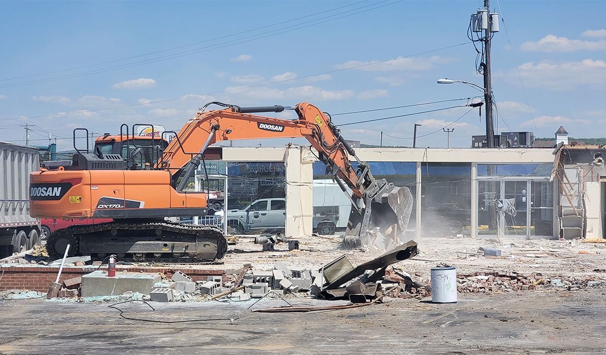 Former Arnold Palmer Motors building comes down